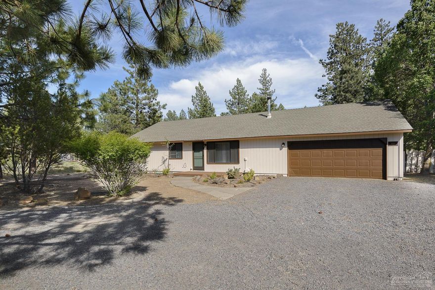 Well maintained single level home on .86 acre lot! Open floor plan featuring great room with certified wood stove installed 11/2012. 3 bedrooms with 2 updated bathrooms with new flooring, cabinets, countertops, sinks & lighting. Sliding glass door off dining area with access to back patio & private yard. Spacious laundry room with built-ins & outside entrance. New exterior paint. Attached finished 2-car garage & extra parking for RV or boat. Great location with easy access to Hwy. 97 and SW Bend amenities.