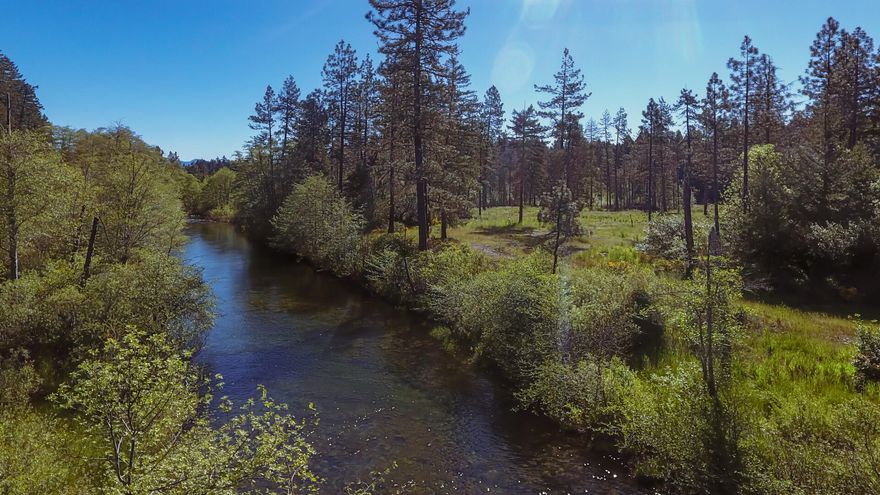 Explore this 5-acre riverfront property along the West Fork of the Illinois River, featuring a 192 sq ft tiny home constructed to frame, siding, and roof—prepared for your completion—alongside the beginnings of a 3,200 sq ft pole barn and 600 amps of connected power. This site combines expansive land and direct river access with established infrastructure, presenting an excellent opportunity for a recreational retreat or permanent residence. Envision kayaking or unwinding by the river, chickens clucking, wind blowing through the trees- all this could be yours.  Call to schedule a showing!
The listing brokerage holds a note on this property