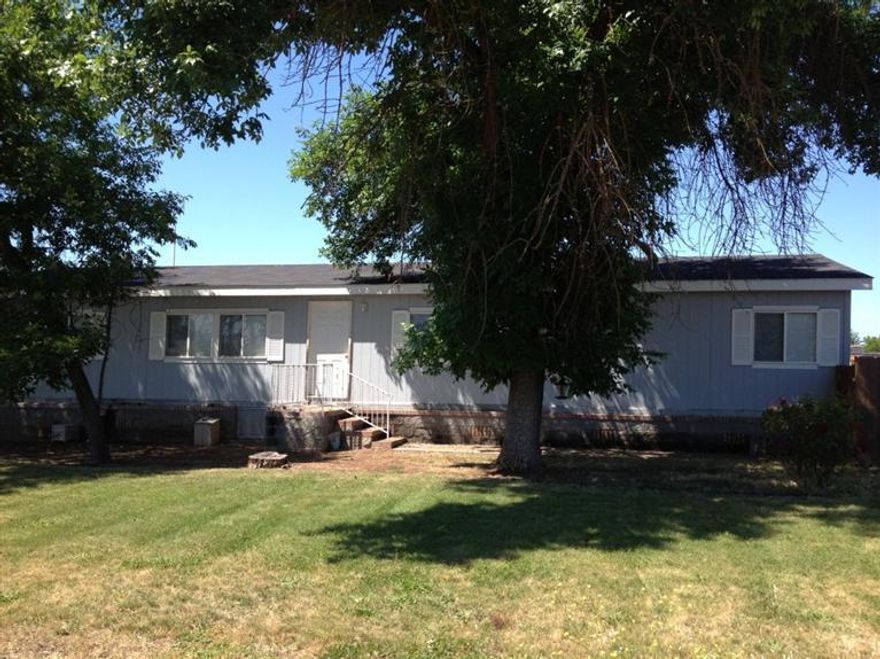 Lots of room in this 2000 built home, 1782 Sqft. of living space with 3 bedrooms and 2 full baths plus a spacious living room featuring french doors leading to a home den/office. Home is on a full perimeter block foundation. Plenty of parking with a 2 car plus car port. Situated on a .24 acre lot.