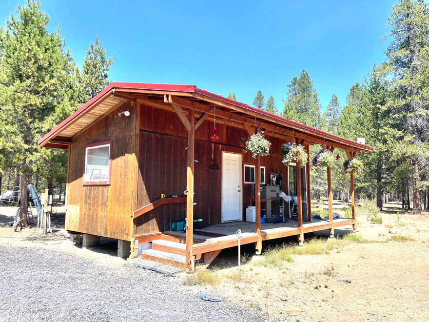 Find your perfect vacation spot on this 5.04-acre property next to forestland with access to Three Rivers OHV trails. Whether you want a peaceful escape or outdoor adventure, this property suits your needs. The 319 sq ft tiny home with a woodstove is cozy, and the fully insulated 24x36 shop with heat, power, and water is great for hobbies, storage, or extra sleeping space. There are three RV hookups, an updated septic system from 2022, a seasonal well, and a 1,000-gallon cistern for convenience. The property also comes with a storage container and a 1970s single-wide mobile home for storage or renovation. The land is open and thinned, making it ideal for outdoor activities, gardening, or future plans. This property offers rustic appeal with modern comforts for vacations, weekend getaways, or as a home base. You can explore the forest and trails or enjoy your privacy. The seller is very motivated and, due to unexpected circumstances, is offering a great price with owner carry terms.