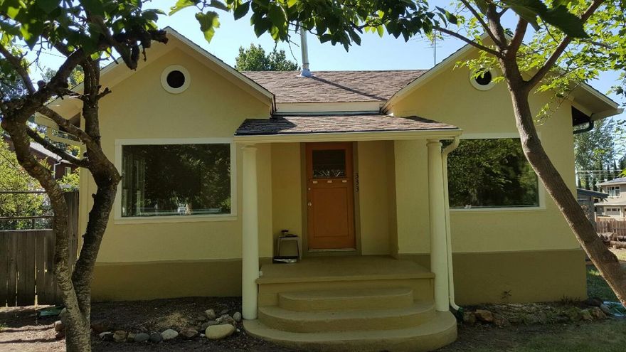 Cottage on large corner lot.