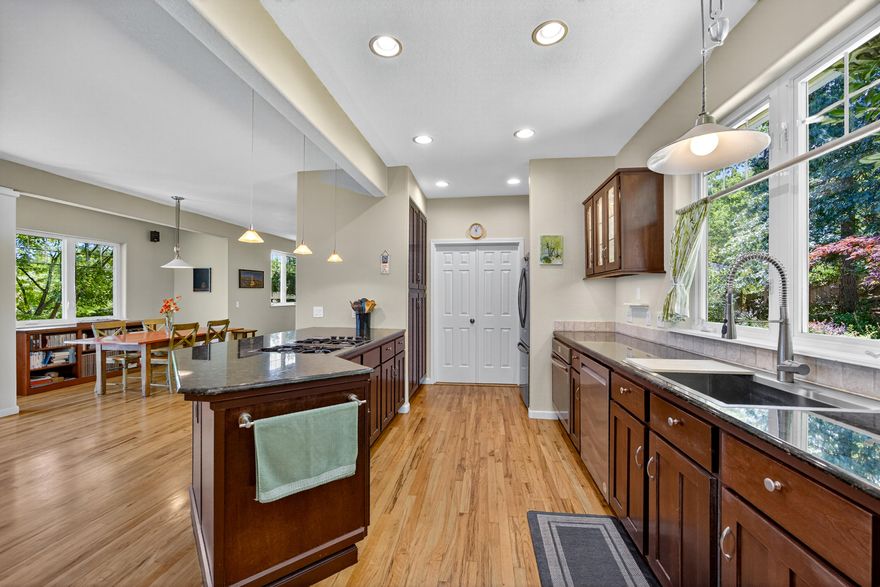 Wonderful, well-maintained home set back from the street on a quiet cul-de-sac, in a neighborhood w/ a creek and access to a vast network of nature trails. This three bedroom, three bath home of approx. 2185 SF, has so much to offer! Nestled in w/ pathways, flowering shrubs and mature plantings, creating a lovely overall setting. Main level of the home offers an open floor plan, spacious kitchen w/ granite countertops, stainless steel appliances and eating bar overlooking the living and dining room areas w/ access to the large back deck, picturesque views of Grizzly Peak, perfect for indoor/ outdoor enjoyment. There's also a versatile space off from the dining area that is currently being used as a music room. Lots of options depending on lifestyle needs! Up the impressive staircase, there are two bedrooms w/ a shared bath, laundry and a spacious primary bedroom suite w/ tall a tall ceiling and wall of windows for those views! This is a great house awaiting the next owners to enjoy!