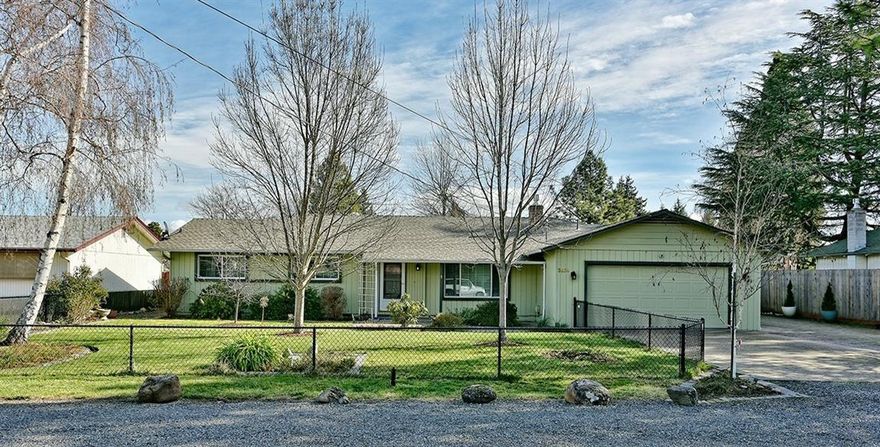 A rare find on a quiet street in Central Point on a .34-acre lot, fully fenced. This 2307sf home offers 2 large bedrooms & 3 full baths & ample living space. Updated kitchen in 2018, w/convenient slide out shelves, lg walk-in pantry, new cabinets & tile backsplash. The master bdrm was remodeled adding ~100sf, walk-in closet & total master bath remodel. The spacious front living rm features a cozy gas fireplace. The 2nd large living rm w/gas stove, has access to its own full bath & backyard via sliding glass door &/or laundry room. (This area has been used for a mother-in-law & private guest room.) The 2nd front bdrm was initially 2 bdrms & can easily turn back. Home has central vac, new furnace & AC in 2014, solar tube & skylight, epoxy finished garage floor & all vinyl windows. Lg covered patio w/ceiling fans & skylights. The delightful backyard has many beautiful flowers, trees, fenced raised beds, pond-less waterfall built by Andreatta Waterscapes, a shop & shed.