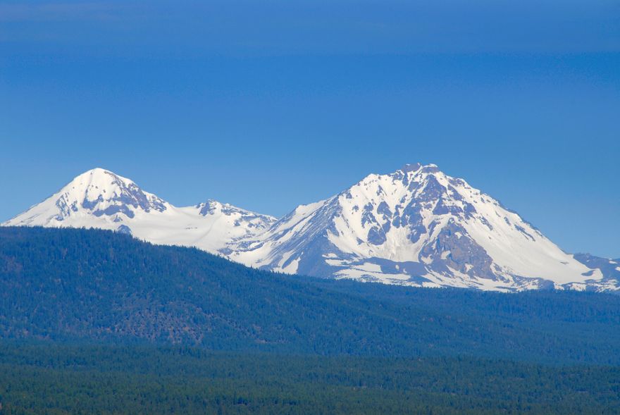 Stunning Cascade mountain views from this treed .71 acre lot on one of Bend's favorite neighborhoods.  This buildable, oversized lot on Awbrey Butte provides privacy and views, yet is just minutes away from downtown, golf, hiking, top schools, and charming shops. Easy access to Mt. Bachelor for year-round recreation. Bring your dreams and your builder.