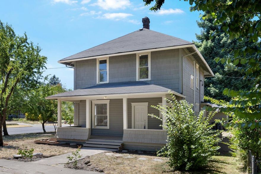 Charming 1910 Gem with Modern Updates & Original Character! Step back in time with this beautifully renovated 1,892 sq ft home. 4 bd/2 ba. Bedroom on main floor is also a great office space.  Nestled on a corner lot, this classic residence combines original character—like built-ins, tall ceilings, & stunning hardwood floors & trim—with thoughtful modern updates including new light fixtures, bedroom flooring, countertops, upstairs bathroom cabinetry, kitchen cabinet doors & appliances. The spacious kitchen & oversized laundry room provide both functionality & charm. Enjoy year-round comfort with the brand-new ductless heating & cooling system. The covered breezeway leads to the detached garage, which includes a versatile shop/studio space perfect for hobbies or remote work-or potential for ADU conversion. Raised garden beds & a sweet front sitting porch! This is a rare opportunity to own a piece of history with all the conveniences of today!