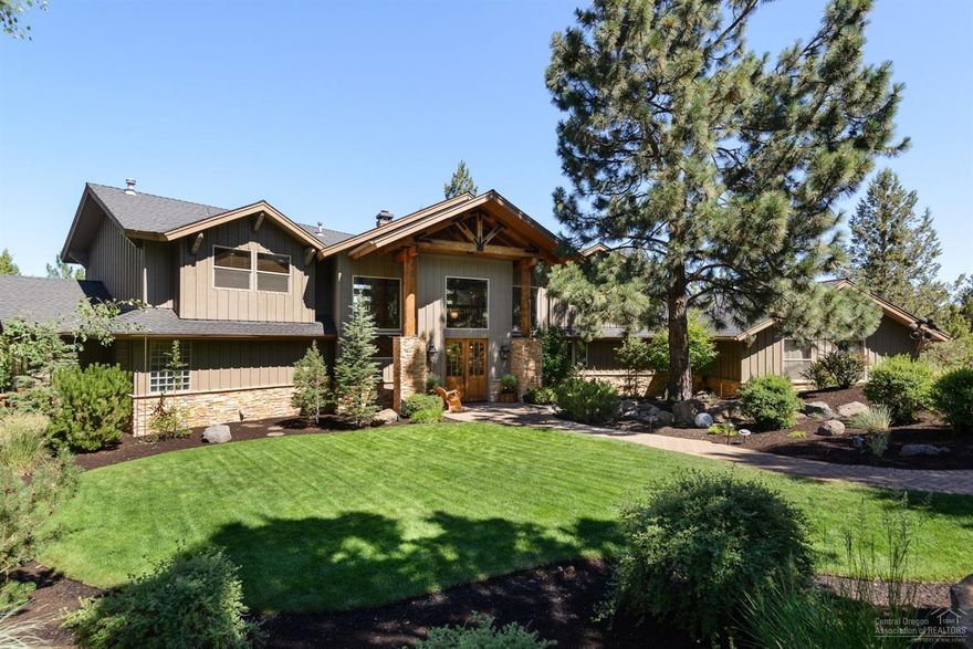 Beautifully treed site with incredible landscaping and a very inviting home. Spacious kitchen with large breakfast bar, dining and family areas. Luxurious main floor master features a tile shower, Jacuzzi tub, see through fireplace & Marquis spa on the private deck. Great room boasts large windows, vaulted ceiling w/exposed beams and wet bar. Unique double staircase leads upstairs to your home movie theater, 3 beds and 2 baths. Amazing outdoor living with extensive decking.