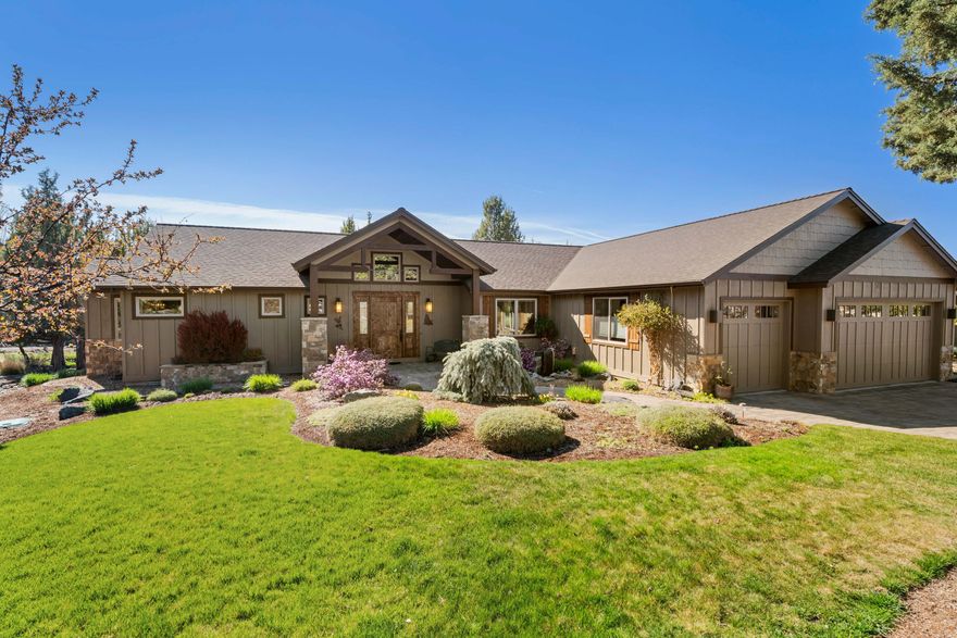 Custom Pacific Northwest craftsman with stunning panoramas of the Cascade Mountains. The property's privileged position backing to Trail Creek and a serene pond creates a natural sanctuary where ducks, geese, quail, and deer often make charming appearances.

The Great Room features vaulted ceilings adorned with rustic wood beam accents and a floor-to-ceiling stone fireplace. Solid Hickory floors, cabinets and built-ins add warmth and character.

Chef's kitchen with slab granite countertops, a custom stone Cascade Mountain backsplash, and a commercial-grade gas range. The expansive island and ingeniously concealed accessible pantry elevate both form and function.

The Primary suite offers separate vanities, a soaking tub and a walk-in closet.

Two additional bedrooms, a full bath, and a conversation-worthy half bath will delight your guests. 
 
A dedicated office, well-appointed utility room, and a triple-car garage complete this residential masterpiece.