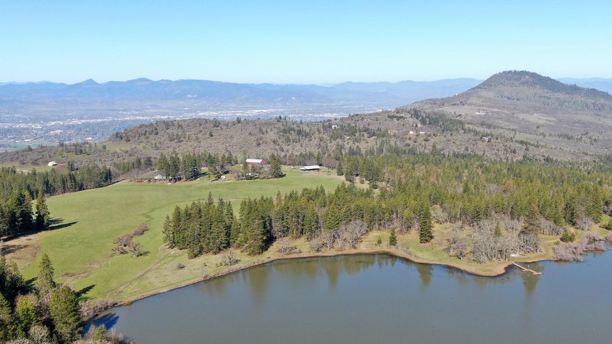 1203 + /- acres with three homes in a beautiful, treed setting next to green pastures and a small private lake with a dock to enjoy family retreats and outdoor entertainment.  Located minutes to hospitals and the Rogue Valley International Airport, this ranch offers the potential for multiple home sites with exceptional views overlooking the valley. Enjoy the many trails for ATV, horseback riding, or hiking. Hunting opportunities include blacktail deer, elk and wild turkey. This family compound will be a place your kids will remember forever