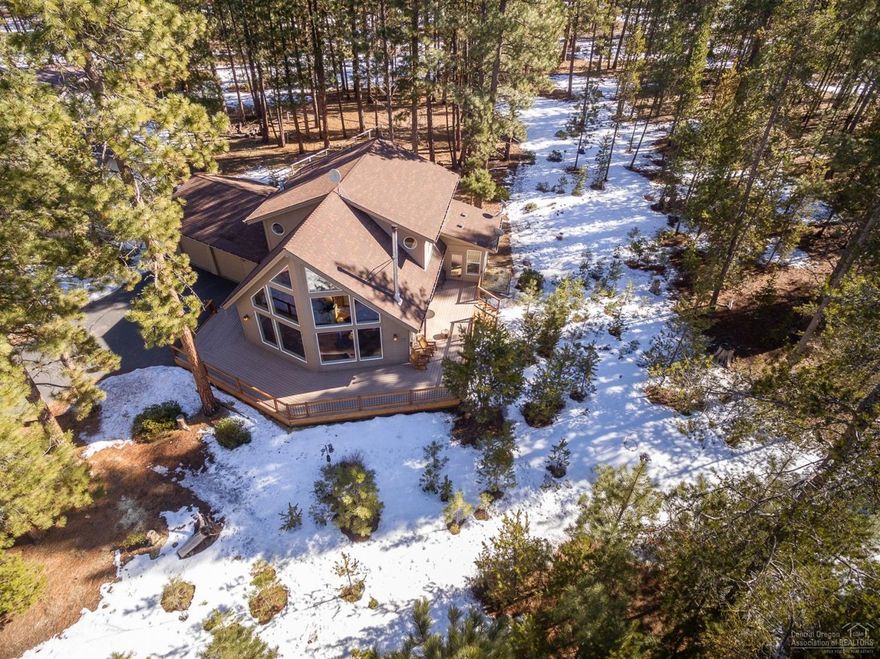 Beautiful chalet style home nestled in the Pines in the desirable community, Wild River. This one of a kind home features an open floorplan, large front facing windows, a lovely kitchen with Corian counters, stainless steel appliances, gas cooktop, and wood cabinetry, a spacious main level master suite with a sunroom, dual vanity, soaking tub and shower, loft, woodburning fireplace with Breckenridge stone, tongue and groove wood accents, wrap around deck, attached oversized two car garage with shop area, AC, and garden beds with blueberries, raspberries, asparagus, and more. Situated on an extremely private .43 acre lot that backs to common area and the Deschutes National Forest. Neighborhood access to the Deschutes River and miles of trails, the Deschutes National Forest in your backyard, and close proximity to the Cascade Lakes make this the perfect Central Oregon escape!