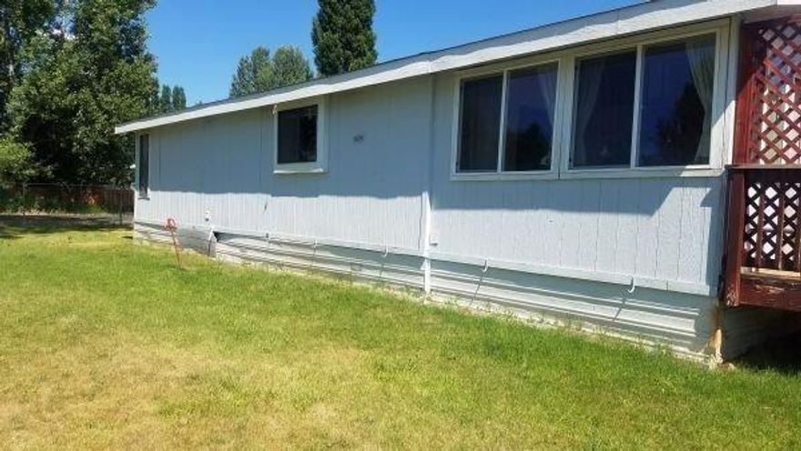 Well maintained manufactured home in quite Round Lake, just over 1/4 acre on a corner lot. Remodeled in 2006 and enclosed porch was converted into dining room. Some updated windows. Sold as-is