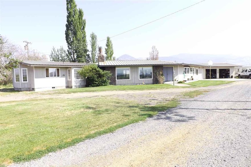 Hard To Find Small Acreage! Enjoy This Almost 3900 Aq. Ft. Home With Lots Of Updates, Open Floor Plan, Plenty Of Room For A Large Family All On 58.5 Acres With Class A Water, Indoor Riding Arena With Stalls And Hay Storage, Outdoor Riding Arena With Roping Chute. Sets Back Off Of The Highway. This Property Is Fenced And Cross Fenced, Mostly Under Flood Irrigation. Outbuildings Including A Shop. This Home Is Ready To Move Into! Runs About 80 Yearlings Seasonal With Taking 1st Cutting Of Hay, Per Owner.
