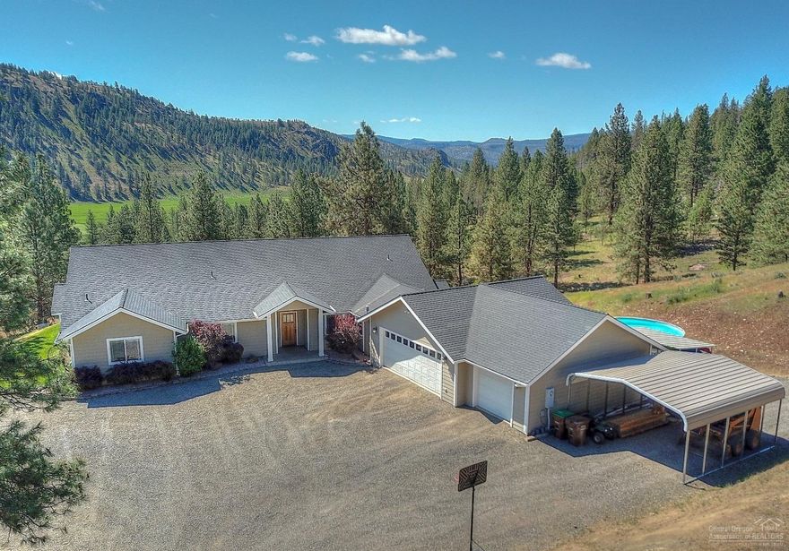 Nestled in mature pines & natural beauty, enjoy picturesque views of the mountainside & valley below. Amazing viewpoints of Mahogany Butte to Ochoco Reservoir. Expansive custom home w/space for a lg family or house full of guests. Spacious kitchen w/tons of storage, two living spaces, den & lg bedrooms. Oversized triple garage w/ work space, dual HVAC & water heaters & an artisian well. Plenty of space to build your dream shop. Property near the Ochoco National Forest & is just 10 minutes from amenities.