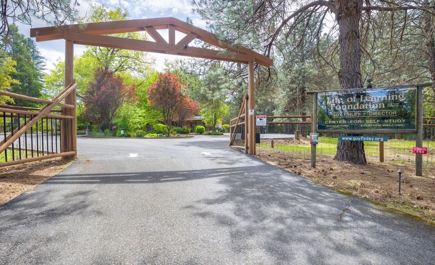 This unique 8.99-acre property, currently home tLife of Learning Foundation, a nonprofit organization founded by spiritual teacher and internationally best-selling author Guy Finley. offers a rare blend of infrastructure, natural beauty, and flexible zoning (RR5), ideal for a retreat center, nonprofit, wellness institute, or faith-based organization. The 5,190 sq ft Church Building includes a kitchen, offices, and living quarters, perfect for gatherings or events. The 5,631 sq ft Annex Building features 5 residential units, restrooms, manager quarters, conference room, kitchen, dining hall, and office space. An additional 2,931 sq ft basement in Annex offers storage, laundry, and workshop areas.The land includes a fruit orchard, two fenced gardens, chicken coop, barn, greenhouse, seasonal pond and stream, outdoor gathering area, and a workshop/garage with living quarters. Located under 35 miles from the Airport and 4 miles from I-5, it combines accessibility with peaceful seclusion.