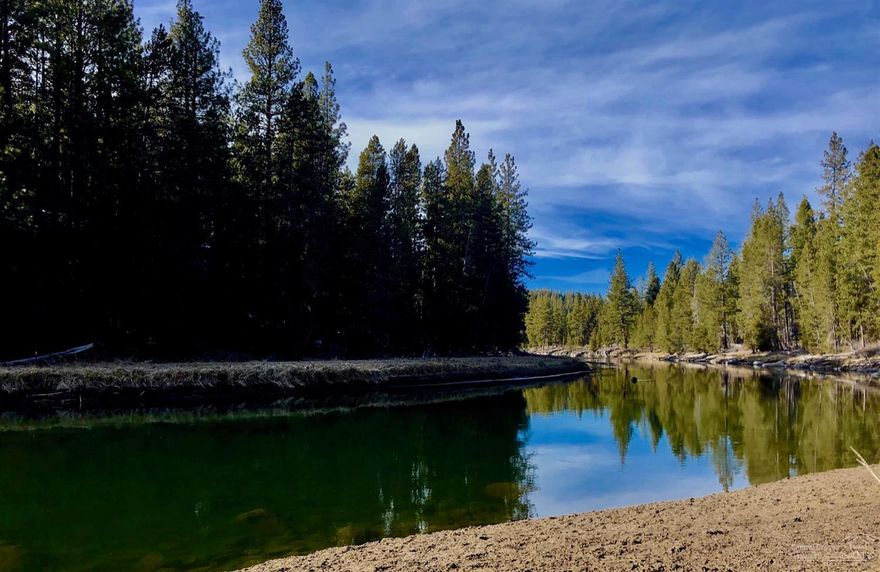 On the Deschutes River and surrounded by the Deschutes National Forest, this peaceful River View Condo #8 has River Views from both the Living Room and Master Bedroom Decks. With no short term rentals allowed (6 mo. minimum), the setting is majestic and the area more private with its own Swimming Pool. This Condo has the great vantage point of being on the curve in the river and the large main deck is great for entertaining. New carpets, stone wood burning fireplace and move in ready. Makes a great getaway 2nd home,long term rental or primary residence on the North West corner of Sunriver.