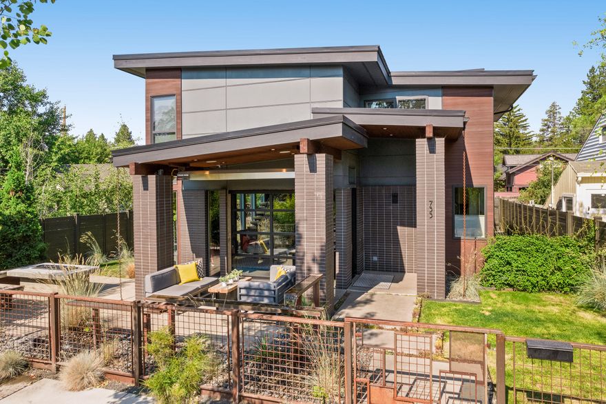 Style and location! Enjoy everything that Bend has to offer from this hip and functional home plus ADU with alley access just one block away from the Galveston corridor. Walk to downtown, Galveston eateries, just a short drive to all the trailheads and Mt. Bachelor. The home has a glass garage door opening to the outdoor living area with a fire-pit, water feature, overhead heater and hot tub. Expansive windows let the beautiful Bend sunshine in, yet the home is private. With open concept living, this home was made for entertaining. Solid surface counters, custom cabinetry, designer lighting, Bosch dishwasher, Kitchen-Aid refrigerator, GE range and hardwood floors. Master on the main level, custom staircase to two more bedrooms ( one is en-suite ) additional bathroom and media/gaming room ( could be a fourth bedroom as it has a closet ). The ADU has a full kitchen and would make a great rental or home office. This truly exceptional home is a must see!!