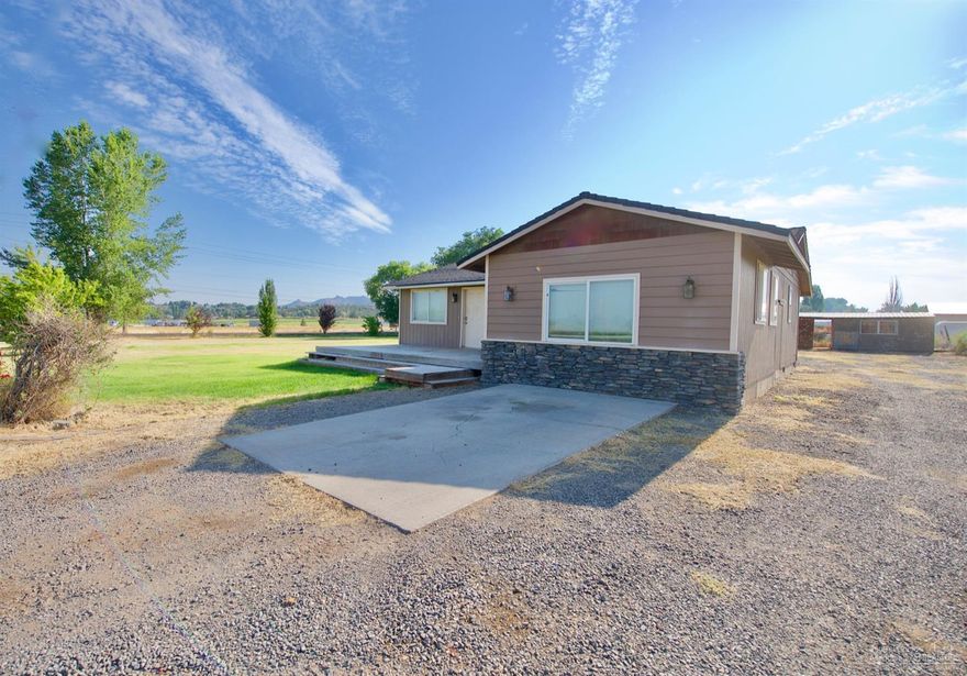 Don't miss this opportunity! Located on a quiet corner lot with just over a 1/2 acre with serene farm land views. This home needs a little TLC and personal touches but offers great bones with solid interior doors, newer windows, newer roof, 2 years new exterior paint, newer heat pump and hot water heater. Underground sprinkler system installed on this flat lot that is awaiting your hobbies, toys, possible barn/shop? So much potential at this price! Don't miss it!