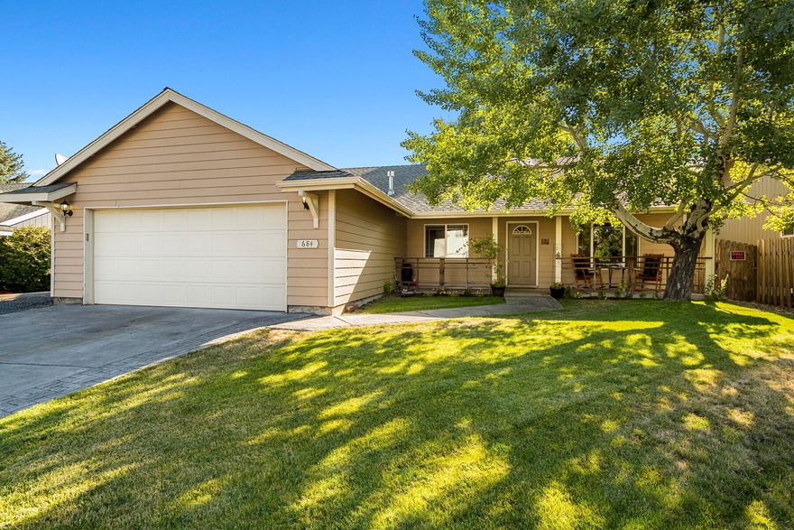 Beautifully-maintained single level home in a growing area of NE Bend. Vaulted ceilings and a skylight create a bright and airy living area. Perfect layout for indoor/outdoor entertaining with slider access to a spacious back deck directly off of the dining room and kitchen. Private, fenced backyard with shade trees, plenty of green space, and a gated gardening area with flower boxes. 2-car garage with a work bench plus parking space for a small RV or boat. Additional features include laminate wood flooring throughout, a spacious walk-in closet and coffered ceilings in the primary bedroom, and a covered front porch. Excellent neighborhood less than a mile from Worthy Brewing, Costco and Whole Foods and down the street from 4.3-acre Providence Park with its playground, jogging trail, and half-court basketball court. Big Sky Park, less than 5 minutes away, offers a regulation soccer field, large and small baseball field, and BMX track.