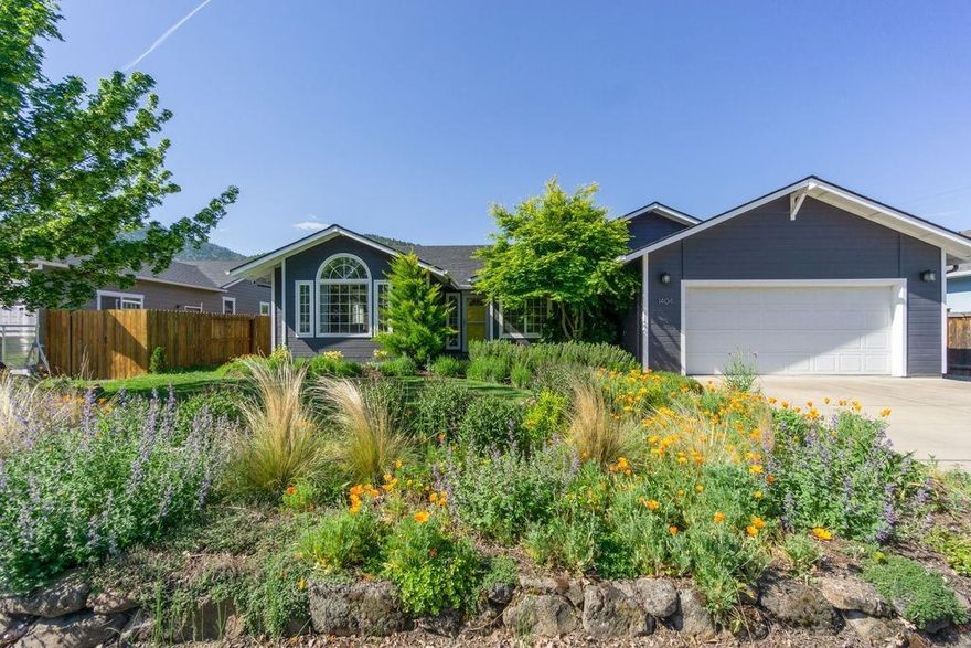 Beautifully updated, single-level, 3 bedroom/2 bath home on a large lot in Talent. This house is better than new! The kitchen has been remodeled and opened up with a large kitchen island, quartz countertops, and stainless-steel appliances. The master suite has a walk-in closet, dual sinks in the bathroom, and glass door to the back patio. The large, irrigated backyard has been professionally landscaped and is laid out perfectly for gardening, lounging, and entertaining on the pergola covered Brazilian teak deck. The roof was replaced in 2018 and the irrigation system was upgraded and overhauled in June 2019. Seller paid First American Home Warranty Value Plus Plan included. Centrally located in a quiet neighborhood in Talent, it is just minutes to Ashland and easy access to I-5. Make an easy appointment to see this beautiful home today!