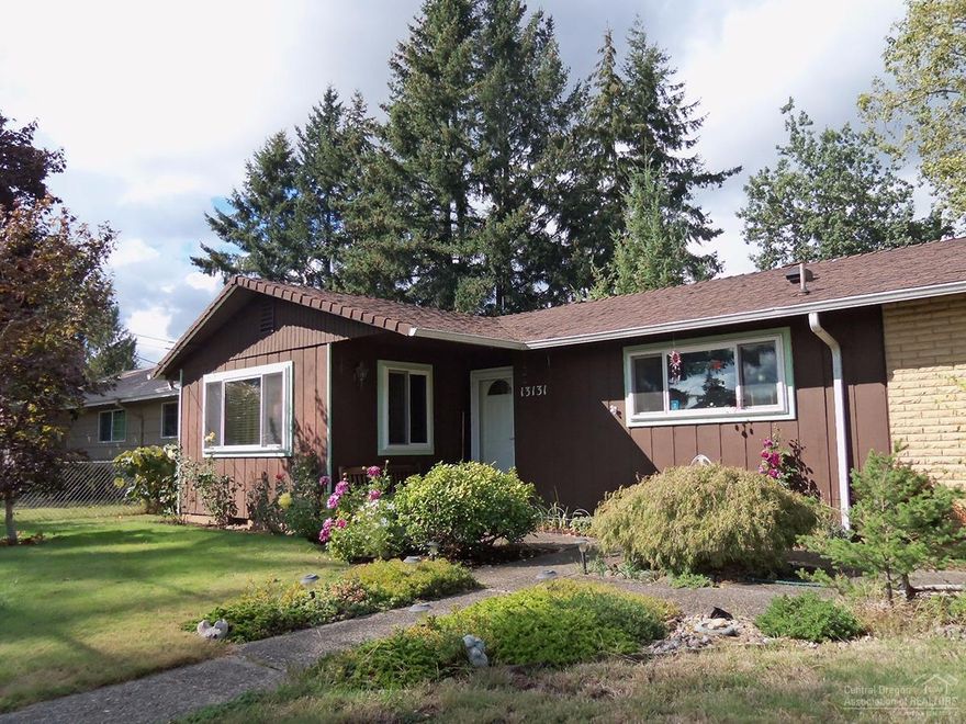 Charming Home with open, Country Kitchen & Wood Burning Fireplace to host friends/family. Plus, large spacious counter area & seating. Lovely separate living room w/Pergo laminate flooring. Highly desirable corner lot, fully fenced, enclosed RV parking w/hookup! Backyard garden area has mature blueberries & plum tree and Tuff Storage shed. Additional features, energy efficient Nest thermostat which controls Central A/C & Furnace remotely, handicap ramp from garage to interior, and newer hot water heater.