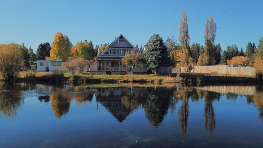 Large home on the Williamson River, popular for trout fishing, kayaking and drift boating. Home has been extensively remodeled inside and out. The interior features spacious kitchen with island, open living and dining area and 2 potential extra bedrooms. Upper balcony and lower deck have a relaxing view of the gently flowing river. This home would make a great vacation home, retirement, primary residence, extended family compound or even an Air B & B type rental.