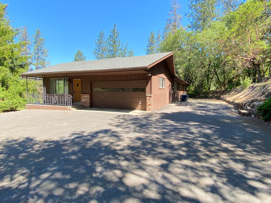 Hard to find a very solid home on the south side of Grants Pass like this home. This one level home with 2 car garage has been well maintained. There is a paved driveway and RV parking. Home has a nice country feel since it sits back from the road. You can enjoy the west facing views from the kitchen and living room. Recently replaced the carpet and installed a new roof, updated kitchen cabinet color and new range-oven and dishwasher. Located about 2,000 feet from the Grants Pass Golf Club and Cathedral Hills Trail system County Park Espey Road entrance. Also in district 7 school system. There is a large shed that can be used for as a workshop or storage or gardening shed. Owner open to negotiate owner carry terms with a sufficient down payment.