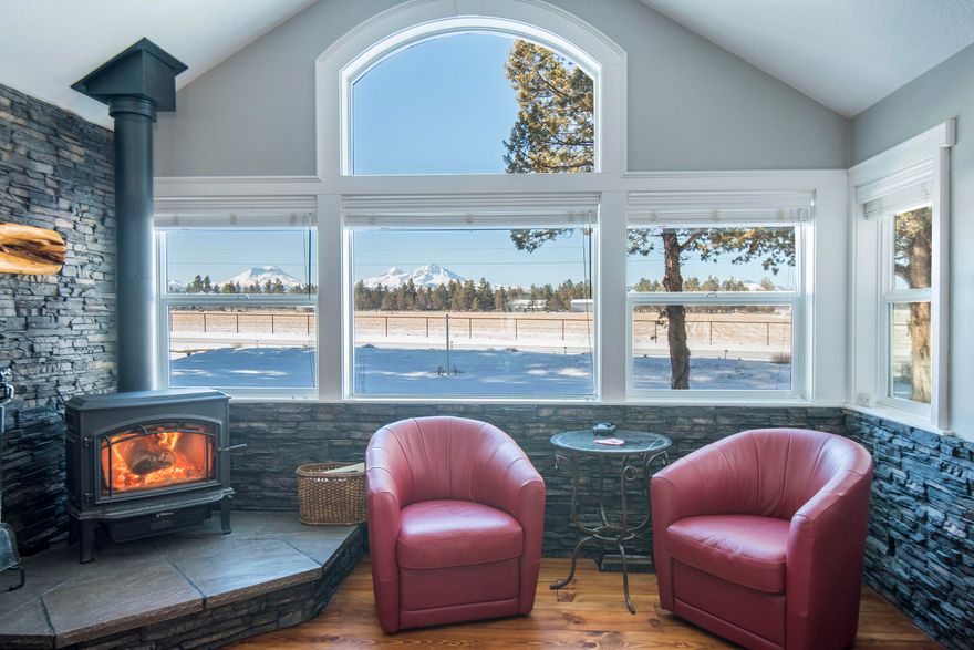 Come home to this lovely property... sought after Cloverdale Rd. with HUGE Cascade Mountain views! This well cared for home features 4 bedrooms/3baths, updated kitchen with granite counters, custom cabinetry, tile floors and stainless appliances. The inviting living/dining room has a wood stove, wide plank pine floors and custom dry stack rock details. Take in the mountain views from the living room, primary bedroom, formal dining area, or even the glassed in nook off the kitchen. Upstairs currently generating income as a short term rental with private entrance. In addition to the 2 car attached garage is a 3 bay shop with 14 ft doors, 16ft trusses and concrete floor.  Shop is 40x60, 2 30amp RV plug ins and shop also wired for 220. Able to accommodate a large motorhome. Though not currently set up for horses, this over 2 acre property allows for that use. New windows on West and South side of home in 2017, New roof 2018, New furnace/heat pump with split zones 2021, House painted 2021