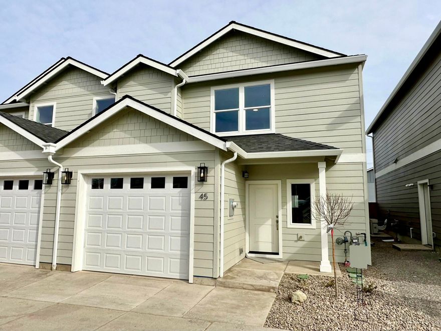 New contemporary home in William Way near downtown Talent built by Harmony Modern Homes. This home boasts and open great room layout and quality amenities throughout including granite countertops, laminate wood floors, white tile floors in the bathrooms & laundry, modern fixtures & hardware, and ceiling fans. The kitchen is open to the living and dining rooms and features mountain views from sink, center island, sleek stainless steel appliances including gas range & hood, white granite counters, ebony stained cabinetry, and pantry. Dining area has access to the covered back patio and fenced back yard. 3 bedrooms, including the primary suite with walk-in closet, are upstairs with the laundry closet and 2 full bathrooms. The heating & cooling system is highly efficient ductless mini-splits. Located in a beautiful, established neighborhood super close to Chuck Roberts park and the dog park as well as downtown Talent amenities. HOA is only $25 per month.