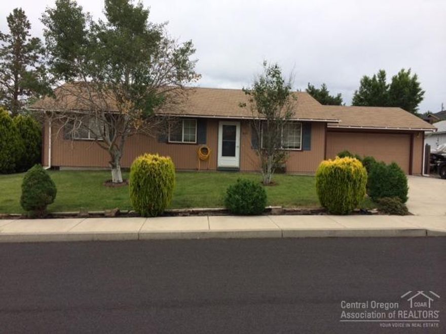 An adorable home at an affordable price. This home features: 3 bedrooms, 2 bathrooms, vaulted ceilings, pergo flooring in the kitchen, dining and great room, skylights in both bathrooms, ceiling fans, nice deck with a huge fenced back yard, landscaped front yard with sprinkler system, garage shelving and much more! Great SW Redmond location and just a couple blocks from Hayden Park.