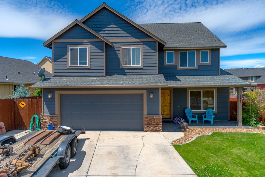 Tucked into a mature neighborhood in NW Redmond, this home is ready for summer fun. With 2 living spaces plus great outdoor living, there is room to entertain a group larger than we're currently allowed! Step into the formal living room from the entry w/a breakfast bar on the edge of the kitchen. Open kitchen space w/central prep island, Granite counters, glass mosaic backsplash & real hardwood floors. Grand two story vault in the Great Room w/gas burning fireplace & open staircase & powder bath between the living areas & garage. Upstairs you'll discover a cozy loft area/office space, Master Ste & 2 additional guest rooms & full bath. Oversized Master bedroom offers a walk in closet, adjoining bath with granite counters, tiled floors, step in shower & soaking tub too! Outside is fully fenced w/auto sprinklers, decorative pergola, privacy panels & fire pit. Gas forced air, A/C. Corner lot, just minutes from the Dry Canyon, downtown Redmond, parkway access & amenities. Don't miss this on