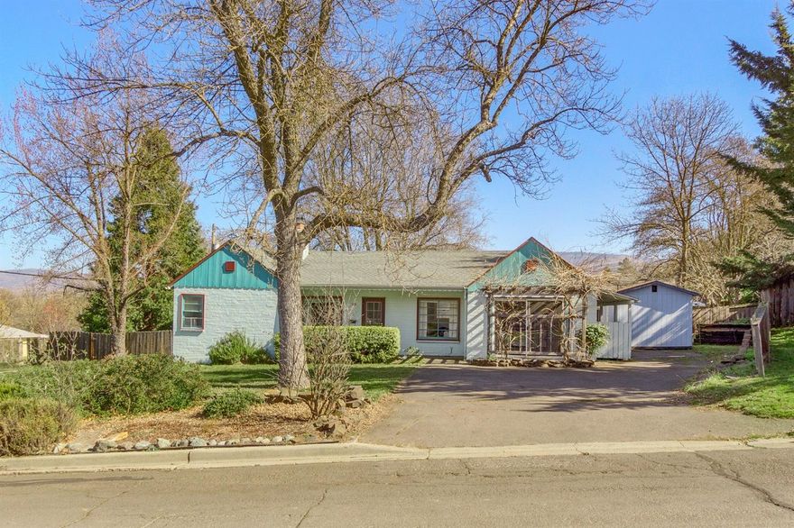 MOTIVATED SELLER! Darling cottage in a quiet Phoenix neighborhood. It features a beautiful open remodeled kitchen with newer stainless steel appliances along with a farm sink. Cozy brick fireplace, beautiful hardwood flooring, good size bedrooms and indoor laundry. Garage converted can be converted back. Great private fenced back yard for relaxing. Wood framed shed for storage along with RV parking. Must see! Move in ready!