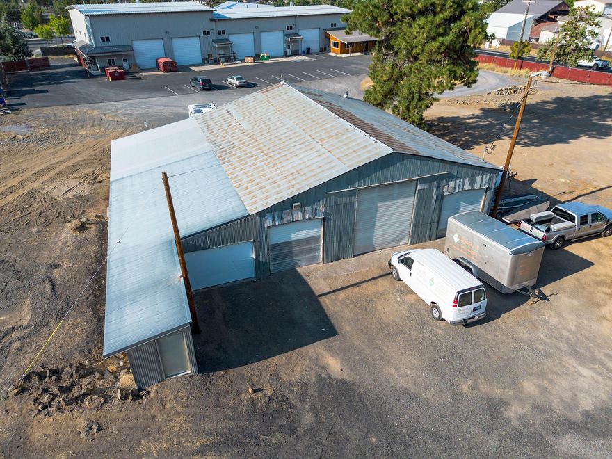 Rare Westside acreage.  3460 Warehouse with 6 roll up doors and separate 760 office (manufactured double wide)  1.72 Acres on corner of OB Riley and Archie Briggs.  ME Zone allows for lots of uses.
Recent upgrades of electric panel, sewer connection.
Phase 1 Environmental recently completed.