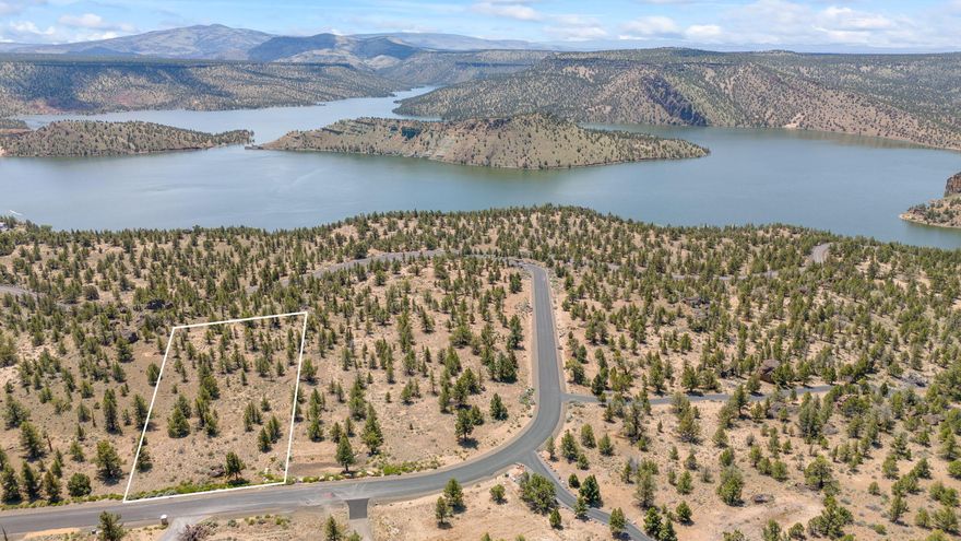 Situated in the gated community of Indian Rock Estates, this 3.63-acre property offers panoramic views of Prineville Reservoir and easy access to boating, fishing, and
water sports—just 2± minutes from the State Park boat ramp. This gently sloped lot features iconic rock outcroppings and borders BLM land, providing endless
opportunities for outdoor recreation. Underground power is in place to preserve the views, water hookup fees are paid, and it's approved for a standard septic. An
80,000-gallon cistern is installed for fire protection. As one of the best-priced lots in the subdivision, this property is a rare opportunity to build your dream home in a
peaceful and scenic setting.