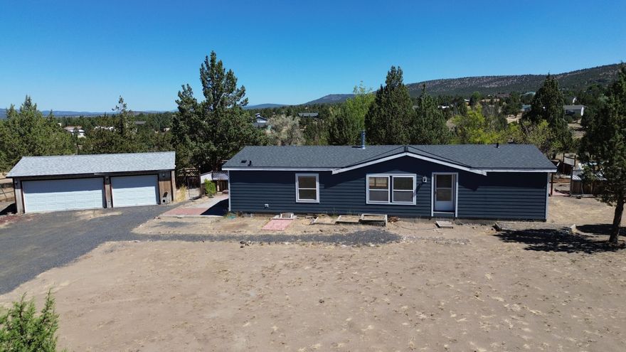 Great starter home on a little slice of Central Oregon's high desert! 3 bedroom/2 bath home includes some exterior updates(Roof and siding were installed summer of 2024). Interior includes vaulted ceiling in main living area, separated bedroom floor plan, additional den, kitchen is open to eating area which features a slider to back yard. Detached garage has a concrete floor and has doubled as a workshop. Home is being sold 'as-is'. Buyer to do their own due diligence regarding home and property.