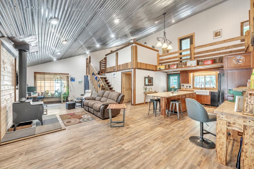 Step back in time—without sacrificing modern comfort—in this one-of-a-kind rustic western saloon-style home, tucked among the majestic Ponderosa Pines of Central Oregon. With timeless character and authentic charm, this unique property blends the bold spirit of the Old West with today's modern amenities. Just minutes from pristine lakes, winding rivers, and scenic mountain trails, it offers year-round adventure—from fishing and hiking to kayaking and snowshoeing.
Whether you're seeking a full-time home, weekend escape, or vacation rental opportunity, this saloon-style gem is a rare find. Embrace the wild beauty of the West—with all the comforts of home.
Updates include new laminate flooring, interior paint in the living area, new clawfoot tub installed.
Full RV hookup, direct access to trail riding for recreational fun, property pins already in place, septic will be pumped with accepted offer