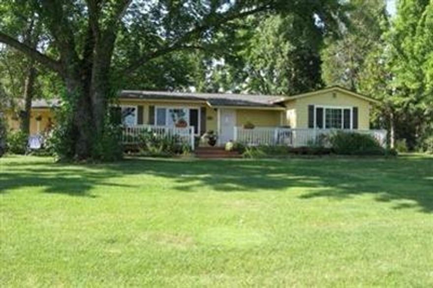 Country Living at its best! Hard to find, one of a kind horse property. Must tour to appreciate! Charming, Clean and Comfortable. Move in ready for your family, pets and horses. Incredible outdoor living space with park like setting with creek, raised garden beds and greenhouse. Home features vinyl windows throughout, hardwood floors and carpet, new Samsung appliances. Brand new bathroom in 2014 with full size granite shower. Kitchen window looks out on to beautiful deck. Private, Peaceful and quiet with paved and gated driveway. Completely fenced and cross fenced. Lots of parking, New detached garage. 36 X 36 barn with 4 stalls and tack room and turn out area also has full size riding arena, 2 separate pastures on 4.50 acres. Excellent well approx. 15 GPM, City Sewer. Come take a tour and be absolutely amazed!