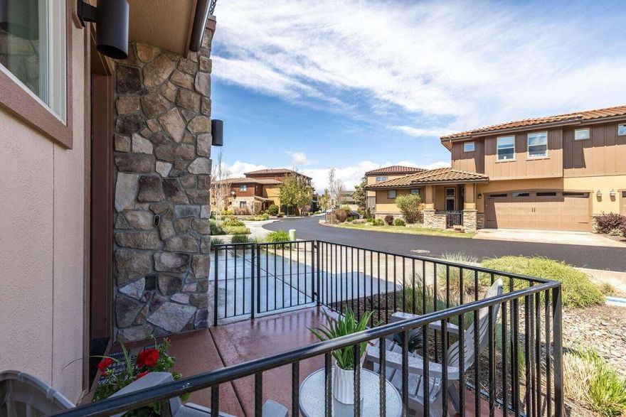 Bright, beautiful, and lovingly maintained inside and out! This warm contemporary home showcases time honored features, including vaulted ceilings, great room concept, french doors, stunning hardwood floors, and much more. The lovely Chef's kitchen includes under cabinet lighting, granite countertops, soft-close drawers, and high-end appliances. Main level primary bedroom is beautiful, with 10' ceilings, huge windows, gorgeous en-suite bathroom with free standing soaker tub and convenient laundry area. The second level is fabulous too, and features three additional bedrooms, a huge theater/bonus space with private balcony, and a giant full bathroom. The community amenities are amazing, and include landscaping, snow removal, street repair, and all exterior maintenance of the home. The clubhouse includes a huge pool, hot tub, and fitness center! Close to the river trail, shopping, restaurants and parks, including Riley Ranch Reserve and Sawyer Park! This is an exceptional property!