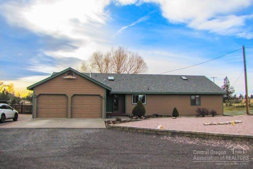 Comfortable country living just a stone's throw from town. 3bd 2ba home on 4.42ac with barn & irrigation. Bring your horses and enjoy the peace & quiet this just out of town'' mini-ranch provides. Home Features: great flow, newer roof/windows - within last 3yrs, bonus room, large dining area, forced air heat/AC, and 2-car garage. Property Features: 2ac irrigation, space for RV/trailer, large shop/barn, & an outdoor living area perfect for entertaining. It's private, very manageable, and ready for you!