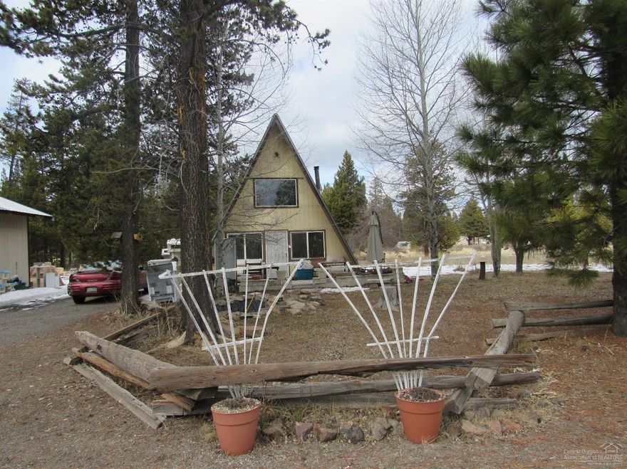 A-Frame home has 2 bedrooms & good bones but needs TLC with deferred maintenance. Needs roof and plumbing. Zoned mixed commercial with lots of possibility. Great opportunity for someone that wants a project or investment! Detached garage/storage. Utility room is also detached.