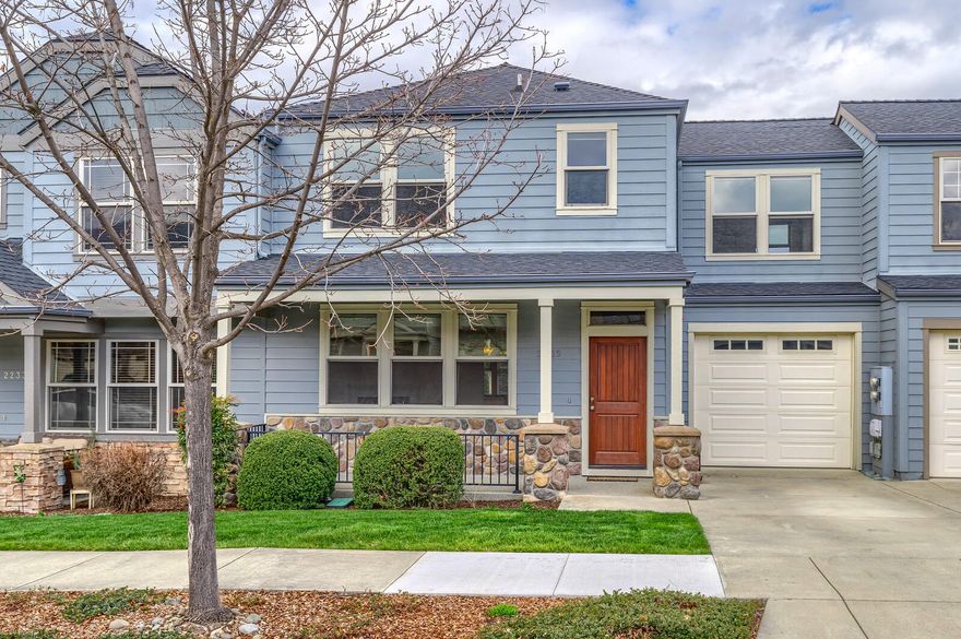 Great opportunity to own a beautiful townhome in the desirable East Village neighborhood! This spacious home has 9 ft ceilings downstairs, with brand new laminate floors, a gas fireplace, and big windows to bring in lots of natural light. One car garage is off the kitchen area along with a half bath. Upstairs you'll find three generous bedrooms, all with walk-in closets and mountain views. The primary suite features coffered ceilings, ceiling fan, and en suite bath. The outdoor living spaces feature poured concrete patios and a private rear area for entertaining. HOA dues of $100 per month covers landscape maintenance of front yard and common area and all irrigation. Come see this low maintenance home for yourself!