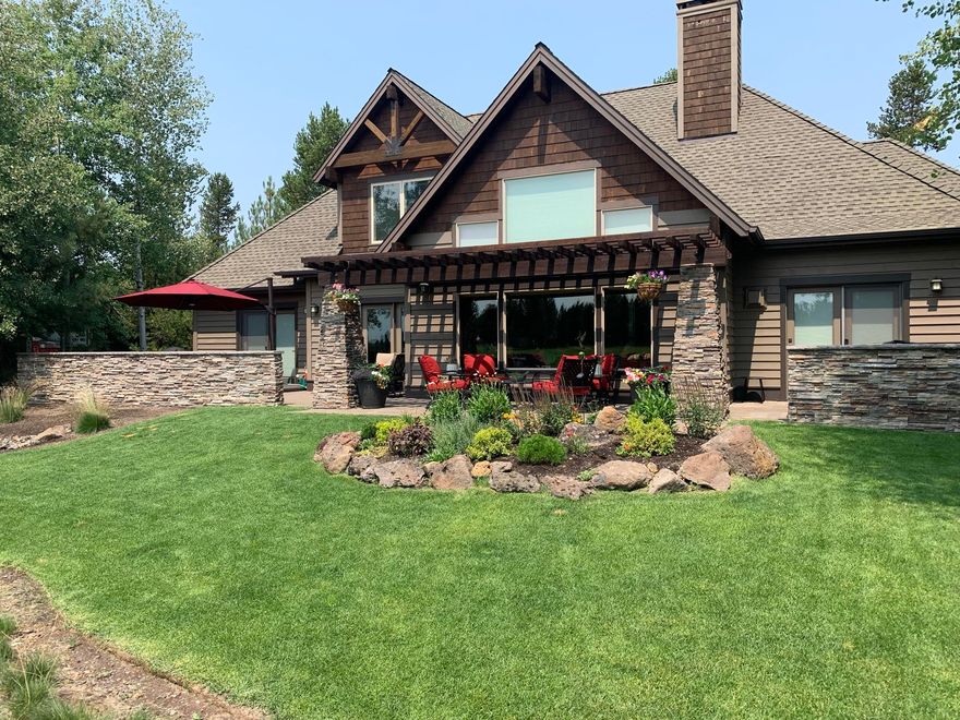 Outstanding southern exposure and view of the par 4 fairway at Caldera Springs enjoys abundance of natural light in the winter. This beautiful custom home features 2 bedrooms w/ensuite bathrooms on the main level. Spacious Office/study or 6th bedroom and craft room.  Oversized gourmet kitchen with hallway pantry and full size wine refrigerator.  Great room includes entry-way leading to a two story great room with beamed ceiling and floor to ceiling windows with southern view. Second floor includes 2 additional bedrooms w/ ensuite bath,  bonus room (or optional 5th bedroom) and two sitting areas/office spaces. Expansive outdoor patio with pavers extends entire length of house and separate dining area with expansive umbrella and an open area off dining room.  Main sitting area covered by open air pergola with access to large grassy area.  Hot tub outside main bedroom suite.  Large 3-car garage with custom cabinetry and custom poured surface finish.