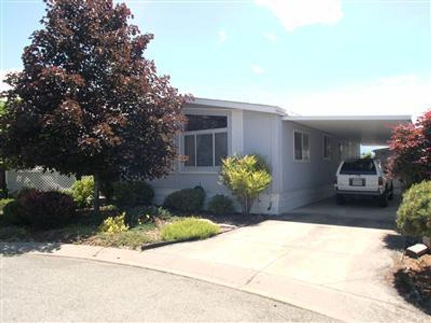 All infomation & sq ft is approximate & subject tochange. Clean double wide mobile home in exclusive 55 & over park, 2 br, 2 ba, 1188 sf, built in 1990, open floor plan, vaulted ceilings, spacious kitchen with new dishwasher, a breakfast bar and skylight, new carpet, new paint, heat pump, covered porch, storage shed, carport, close to hospital and shopping.