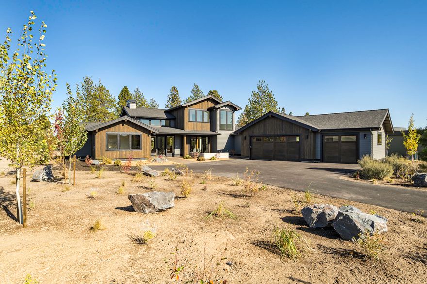 Beautiful NW Contemporary home in Tetherow by one of Bend's finest home builders, Larraneta & Company. Situated on over a half-acre, this 2940 SF two story home features an open great room floor plan, gourmet kitchen, 2 main level suites, study and 3-car garage. Abundant natural light extensive windows, high ceilings and designer finishes add to this custom home. Hardwood floors throughout main living areas. Spacious kitchen with professional series appliances, large island and separate pantry/hobby or 2nd office room. Custom Rift white oak cabinetry and slab quartz counters throughout. Contemporary high-end lighting and plumbing fixtures. Main level master suite features tile curb-less shower, soaking tub and large walk-in closet. Upstairs bonus/media room, bedroom and full bath allows for guest separation. Expansive outdoor living area with covered patio that backs to common area.