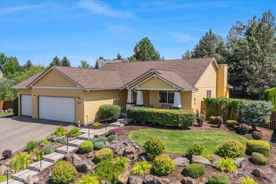 Welcome to Elkhorn Estates on Bend's southwest side—where single-level living meets comfort and convenience. This 3 bedroom, 2 bathroom home has an open layout with vaulted ceilings in the main living areas and a kitchen featuring stainless steel appliances and plenty of storage. Efficient gas heat and central A/C make the home comfortable in every season. Enjoy your morning coffee on the front porch with Cascade Mountain views, or unwind on the private back patio— prewired for a hot tub. The large yard is beautifully landscaped and feels tucked away, offering a quiet space to relax or entertain. A heated paver driveway leads to the roomy 3-car garage, perfect for extra storage, gear, or hobbies. Located in an established Bend neighborhood— with direct neighborhood access to the Historic Canal Trail, River Trail and only minutes to Farewell Bend Park, the Old Mill District, and the Deschutes River, this home puts recreation, shopping, and dining within easy reach.