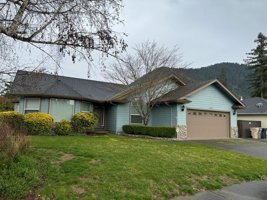WOW... what an opportunity to bring some sweat equity in a beautiful neighborhood in SE Grants Pass. Just blocks from the scenic Rogue River.   This home has a great floor plan, corner lot, beautiful mountain views and large backyard.  One bedroom up front easily usable as an office. You won't be disappointed with this great opportunity.