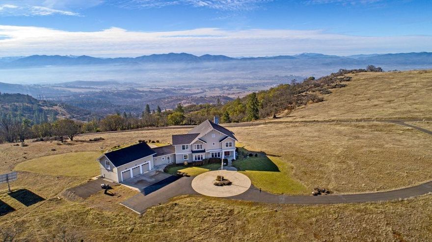 East Medford Hills w/ over 80+ acres w/ a paved road and gated entry. Beautiful views of Valley, City Lights & Mountains. First time on the market, New England craftsman style custom Pagnini built w/ charm. Custom wood work, crown moldings, bookcases, window seals, many wood floors, wood Pozzi windows, open kitchen w/ lg island, built in sub zero refrige, dbl ovens, open beams looking into family rm w/ brick gas log fireplace. Walk in butlers pantry, Sunroom w/ brick floors & French sliders, wet bar & bar refrige that takes you out to the Solar heated gunite pool & patio areas for entertaining. Formal living rm w/ wood burning fireplace, sitting rooms. Master suite w/ 2 guest suites, Carrera marble tile floors & counters w/ dbl sinks and nice shower, separate soaking tub. Lg 3 car garage w/ staircase to finished bonus rm. Solar back up generator. Great mud/laundry rm w/ many cabinets slate floors & full bath. This property is nothing like any other in East Medford!