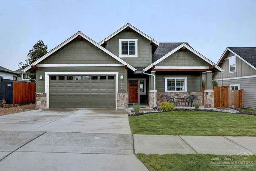 Watch the fireworks from this charming upgraded home! Rock surround fireplace in LR with vaulted ceilings and slider to deck with xeriscape landscaping in backyard and raised garden beds. Skylights illuminate kitchen with slab granite counters and upgraded appliances. Additional slider off dining area to small deck. Exposed beams, wrought iron on stairwell, and unique lighting fixtures. Hand textured drywall. Small bonus room upstairs would be great for an office!