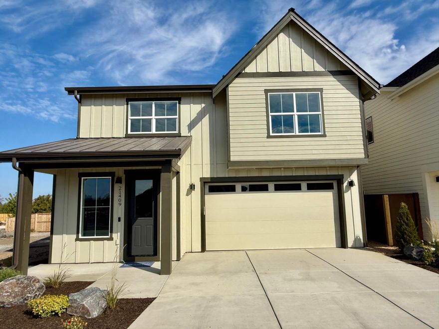 Welcome to this Stone Bridge Homes NW-built residence in Bend's Stevens Ranch! The main level features a two-car garage and an open living area. The kitchen and great room include hardwood floors, stainless steel appliances, a walk-in pantry, quartz countertops, and a gas fireplace. Upstairs, the primary suite has double vanities, a tiled shower, and a walk-in closet. There are also three bedrooms and a bonus loft area. Additional amenities include A/C, fencing, landscaped yards, Earth Advantage certification, and a 2-10 Home Buyer's warranty. Stevens Ranch offers parks, trails, caves, shopping, dining, and the new county library nearby.