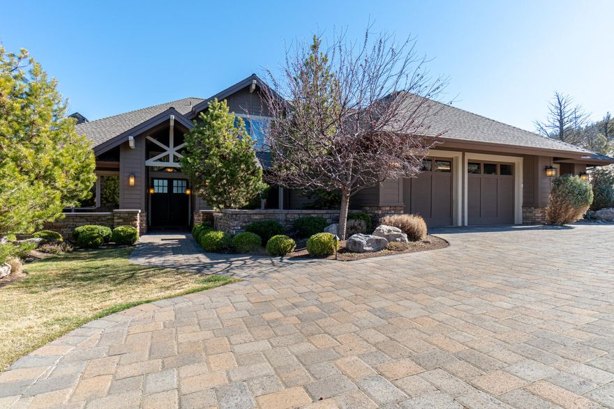 Gorgeous Eagle Crest home with stunning views of The Cascades and Smith Rock! Soaring ceilings, walls of windows, and luxury finishes throughout. Great room plan with two primary suites, den, and bonus room. Gourmet kitchen with slab granite counters, alder cabinets, built-in buffet with china display, and large kitchen island. An expansive paver deck and patio with pergola for enjoying sunrises and sunsets. Paver driveway, front courtyard with water feature, and a triple car garage with built-in workbench. Huge storage room under home. Eagle Crest is home to three 18 hole golf courses, three sports centers, and miles of trails.