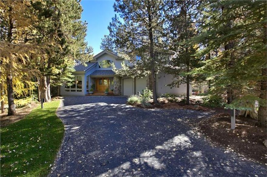 Beautiful, well maintained, private custom home, one owner-never rented. Light, bright with 7 skylights, private upper deck and lower expansive deck overlooking pond, waterfall and large private common area. Granite, high end appliances, carpeting and NEW furnace. Stereo surround system throughout, LOTS of storage. Bedrooms with private bath upstairs and down, lower could easily be converted to 2nd master suite. Oversized garage doors to accommodate small camper. MUCH more. BELOW recent appraisal price