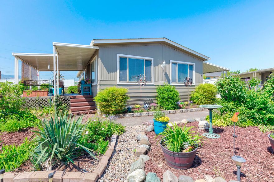 Home is on LARGE corner lot in a family park! This 2 bedroom 2 bath home has many improvements, including in 2020 new roof, new paint inside and out, Samsung appliances, Heat Pump, and an air purifier. In 2023, new duct work, new water heater(40gal), window trim and newer mini blinds and high efficiency toilets. Two sheds on the property with power to them. If that isnt enough, the amount of yard space is very inviting. The new beautiful club house has pool tables, swimming pool, hot tub, gym, playground, meeting space and so much more. Buyer must apply to park and be accepted. Buyer to due their due diligence on park rules and property requirements.
